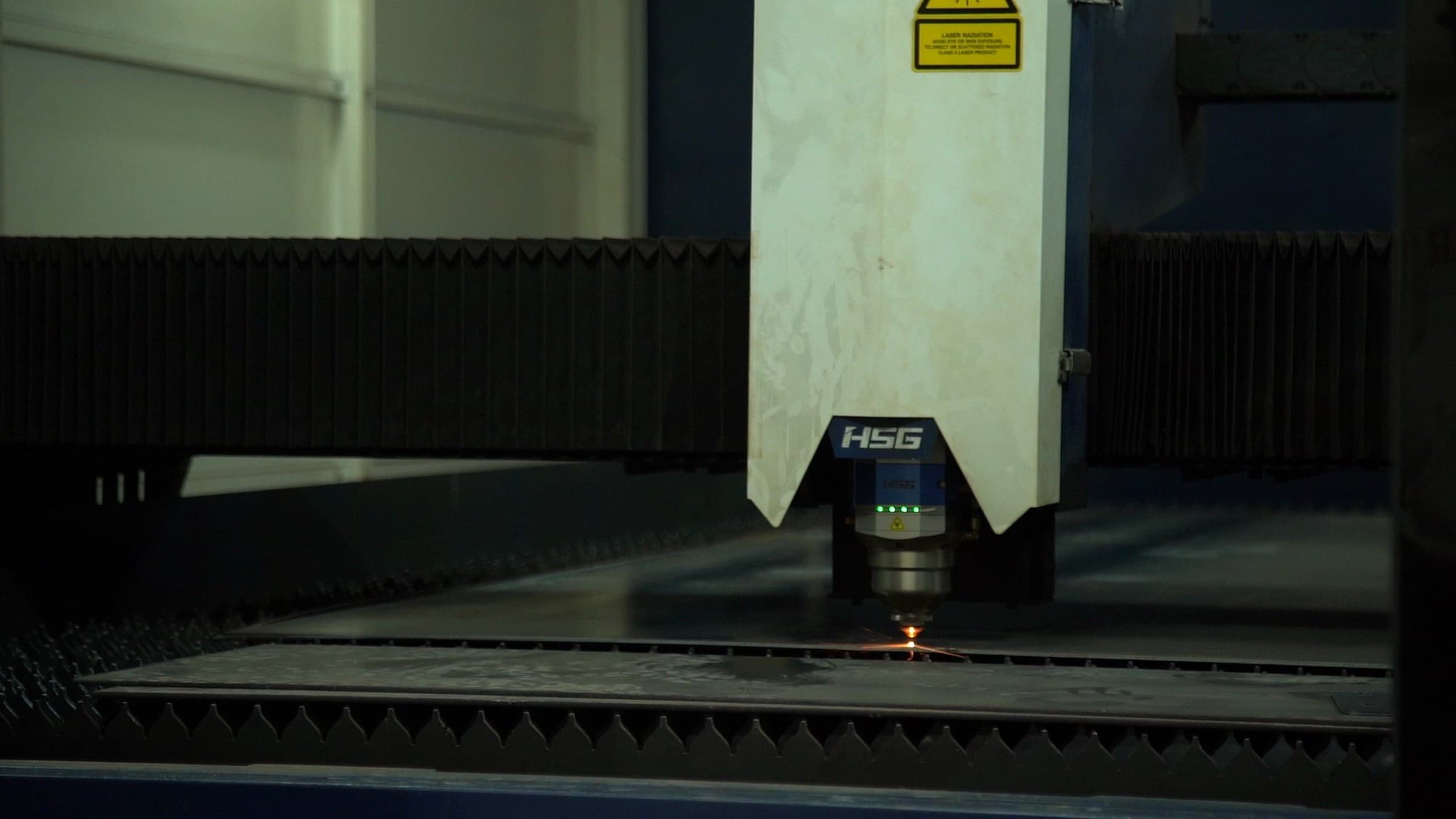 Fiber laser cutting steel plate at a Heartland client's fabrication shop
